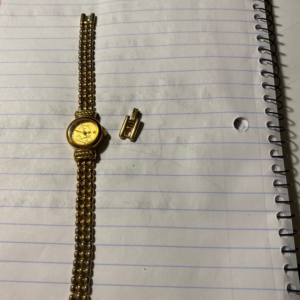Women’s gold Winnie the Pooh watch